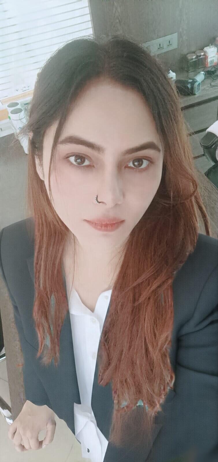 Vibha Jain, hypnotherapist at Hypnotherapy Pvt Ltd, wearing a dark blazer over a white shirt.
